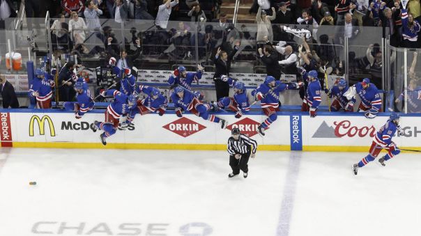 Rangers bench celebrates an overtime win 5-13