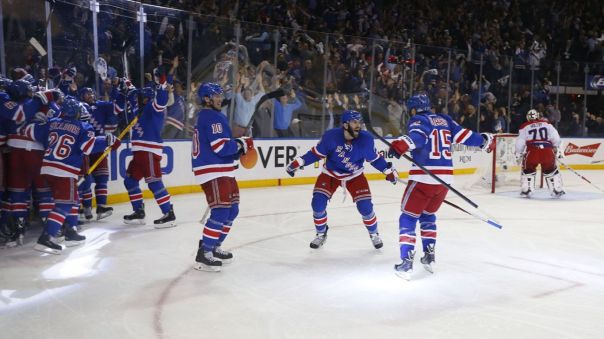 Rangers celebrate an overtime win 5-13