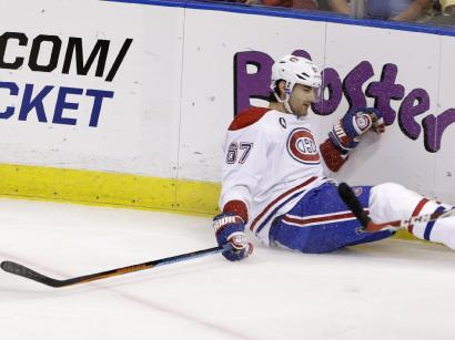 Montreal Canadiens left wing Max Pacioretty (67) falls on the ice during the first period of an NHL hockey game against the Florida Panthers, Sunday, April 5, 2015 in Sunrise, Fla. Pacioretty left the ice after being interfered with by Panthers defenseman Dmitry Kulikov of Russia,  then falling backwards into the boards after his skate made contact with defenseman Alex Petrovic's. The Canadiens defeated the Panthers 4-1. (AP Photo/Wilfredo Lee)