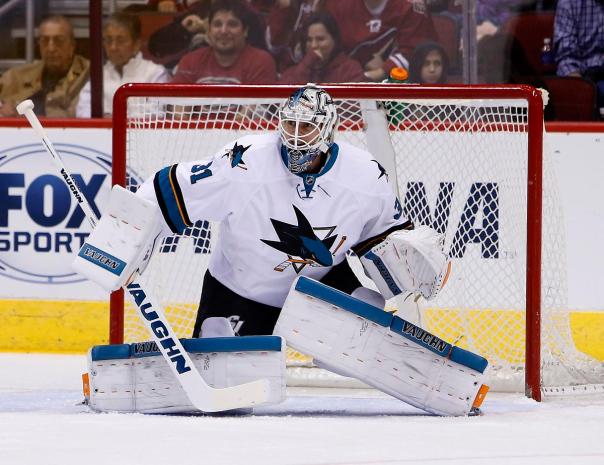 FILE - In This Friday, Oct. 2, 2015, photo, San Jose Sharks goalie Martin Jones (31) works against the Arizona Coyotes in the first period during a preseason NHL hockey game in Glendale, Ariz. After missing the playoffs for the first time since 2003, the Sharks are no longer facing questions about what it will take to succeed in the postseason. Now it's about whether they can even make it.  (AP Photo/Rick Scuteri, File)