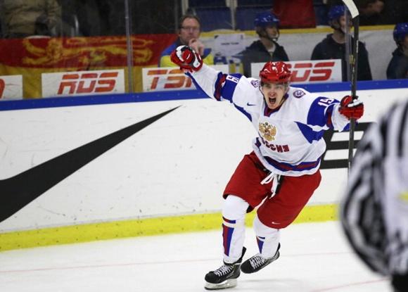 Russia's Pavel Buchnevich celebrates after scoring the 3 - 5 in the empty goal after the team of the US took out their goalie in the final minute of the World Junior Ice Hockey Championships quarter final match between USA and Russia in Malmo, Sweden on January 2, 2014. AFP PHOTO / TT NEWS AGENCY / ANDREAS HILLERGREN / ** SWEDEN OUT ** (Photo credit should read ANDREAS HILLERGREN/AFP/Getty Images)