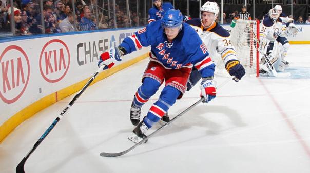 JT Miller protecting the puck 12-1.jpg